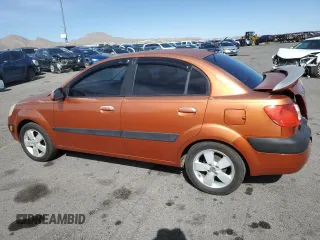 2009 Kia Rio SX with VIN KNADE223496514284, listed as a Copart auction lot 48550105 with 114,411 mi miles and Salvage Title. Bid and sale history available at carsss.com. Image 2.