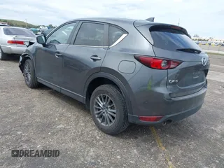 2021 Mazda CX-5 Touring with VIN JM3KFACM1M0461510, listed as a IAAI auction lot 41660439 with 30,352 mi miles. Bid and sale history available at carsss.com. Image 3.