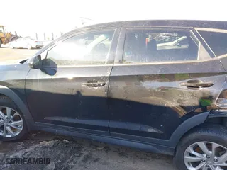2019 Hyundai Tucson Value with VIN KM8J33A4XKU979791, listed as a IAAI auction lot 41255630 with 90,807 mi miles. Bid and sale history available at carsss.com. Image 14.