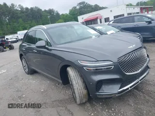 2023 Genesis GV70 2.5T z VIN KMUMADTB7PU103287, wystawiony jako IAAI lot #42112852 z przebiegiem 27 535 mil mil oraz . Historia ofert i sprzedaży dostępna na DreamBid. Obrazek 1.