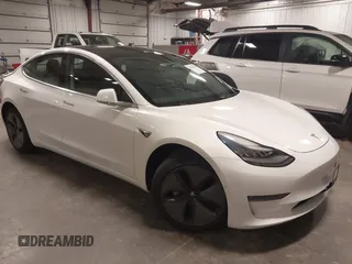 2019 Tesla Model 3 Mid Range z VIN 5YJ3E1EA5KF317542, wystawiony jako IAAI lot #42050461 z przebiegiem 55 054 mil mil oraz . Historia ofert i sprzedaży dostępna na DreamBid. Obrazek 1.