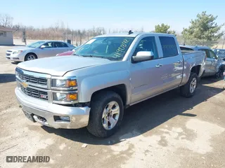 2015 Chevrolet Silverado 1500 LT with VIN 3GCUKREC0FG316716, listed as a IAAI auction lot 41908921 with 242,093 mi miles. Bid and sale history available at carsss.com. Image 2.