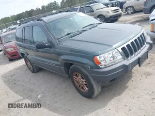 2003 Jeep Grand Cherokee with VIN 1J8GX48S03C614694, listed as a IAAI auction lot 41892668 with 185,211 mi miles and . Bid and sale history available at DreamBid. Image 1.