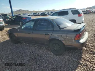 1999 Saturn SL with VIN 1G8ZK527XXZ136922, listed as a Copart auction lot 86704404 with 134,897 mi miles and Salvage Title. Bid and sale history available at carsss.com. Image 2.
