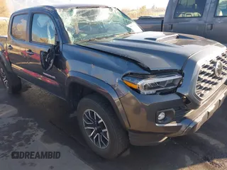 2023 Toyota Tacoma SR with VIN 3TMCZ5AN2PM553928, listed as a IAAI auction lot 40999044 with 9,210 mi miles and . Bid and sale history available at DreamBid. Image 6.