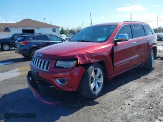 2014 Jeep Grand Cherokee Overland with VIN 1C4RJFCG2EC216406, listed as a IAAI auction lot 41944794 with 124,007 mi miles. Bid and sale history available at carsss.com. Image 17.