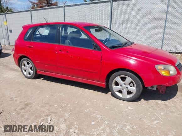 2009 Kia Spectra with VIN KNAFE241995024997, listed as a IAAI auction lot 42095812 with 217,555 mi miles. Bid and sale history available at carsss.com. Image 1.