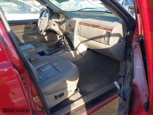 2004 Jeep Grand Cherokee Limited with VIN 1J8GW58N64C329504, listed as a IAAI auction lot 41785215 with 124,952 mi miles. Bid and sale history available at carsss.com. Image 5.