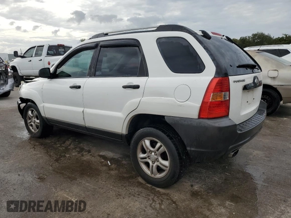 2005 Kia Sportage LX with VIN KNDJF723557078730, listed as a Copart auction lot 79823504 with 166,509 mi miles and Salvage Title. Bid and sale history available at carsss.com. Image 2.