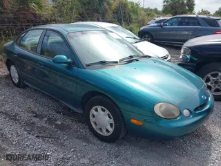1997 Ford Taurus GL with VIN 1FALP52U8VA147714, listed as a IAAI auction lot 40781743 with 57,823 mi miles. Bid and sale history available at carsss.com. Image 1.