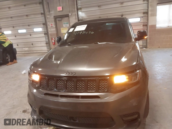 2018 Jeep Grand Cherokee SRT z VIN 1C4RJFDJ6JC432683, wystawiony jako IAAI lot #41971436 z przebiegiem 113 078 mil mil oraz . Historia ofert i sprzedaży dostępna na DreamBid. Obrazek 11.