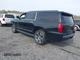 2019 Chevrolet Suburban LT with VIN 1GNSCHKC2KR408575, listed as a IAAI auction lot 42060103 with 144,838 mi miles and . Bid and sale history available at DreamBid. Image 3.