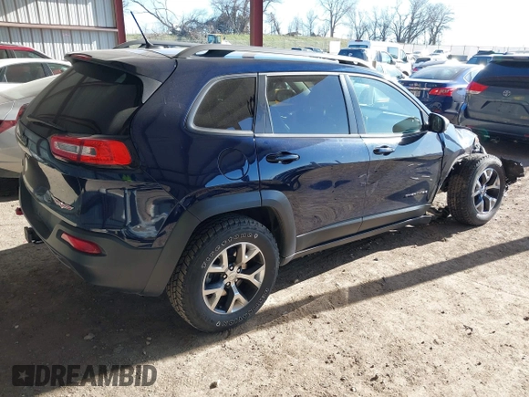 2015 Jeep Cherokee Trailhawk with VIN 1C4PJMBB1FW520649, listed as a IAAI auction lot 41991904 with 168,533 mi miles and . Bid and sale history available at DreamBid. Image 4.