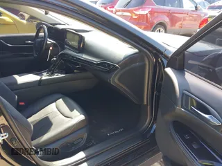 2023 Toyota Mirai XLE with VIN JTDAAAAA9PA009170, listed as a IAAI auction lot 42234998 with 34,363 mi miles and . Bid and sale history available at DreamBid. Image 5.