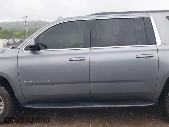2019 Chevrolet Suburban LT with VIN 1GNSKHKCXKR405555, listed as a IAAI auction lot 42188860 with 143,435 mi miles and . Bid and sale history available at DreamBid. Image 14.