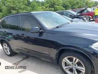 2014 BMW X5 xDrive50i with VIN 5UXKR6C55E0C03743, listed as a IAAI auction lot 42268302 with 118,892 mi miles and . Bid and sale history available at DreamBid. Image 13.