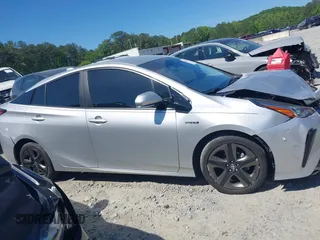 2020 Toyota Prius L Eco z VIN JTDKARFUXL3125434, wystawiony jako IAAI lot #42201623 z przebiegiem 58 609 mil mil oraz . Historia ofert i sprzedaży dostępna na DreamBid. Obrazek 13.
