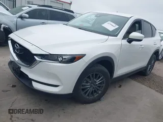 2017 Mazda CX-5 Touring z VIN JM3KFBCL5H0128584, wystawiony jako IAAI lot #42354669 z przebiegiem 56 563 mil mil oraz . Historia ofert i sprzedaży dostępna na DreamBid. Obrazek 17.