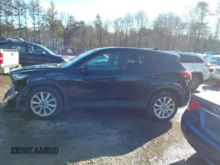 2014 Mazda CX-5 Grand Touring with VIN JM3KE4DY1E0303658, listed as a IAAI auction lot 41536769 with 158,777 mi miles. Bid and sale history available at carsss.com. Image 13.