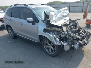 2015 Subaru Forester Touring with VIN JF2SJAUC6FH470383, listed as a IAAI auction lot 42395811 with 138,623 mi miles and . Bid and sale history available at DreamBid. Image 1.