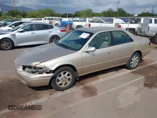 1999 Toyota Camry LE z VIN JT2BF22K9X0222119, wystawiony jako IAAI lot #41529258 z przebiegiem 119 919 mil mil oraz . Historia ofert i sprzedaży dostępna na DreamBid. Obrazek 2.