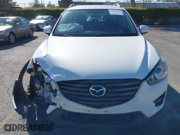 2016 Mazda CX-5 Sport with VIN JM3KE2BY9G0879654, listed as a IAAI auction lot 41819154 with 65,586 mi miles. Bid and sale history available at carsss.com. Image 12.