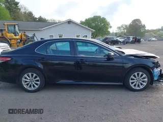 2020 Toyota Camry LE with VIN 4T1C11AK2LU393699, listed as a IAAI auction lot 42123267 with 66,932 mi miles and . Bid and sale history available at carsss.com. Image 14.