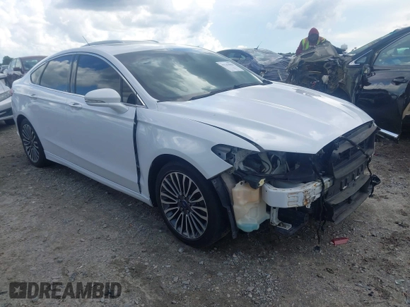 2017 Ford Fusion Titanium z VIN 3FA6P0K93HR203063, wystawiony jako IAAI lot #42243064 z przebiegiem 176 078 mil mil oraz . Historia ofert i sprzedaży dostępna na DreamBid. Obrazek 1.