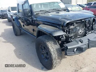 2023 Jeep Gladiator Sport S z VIN 1C6HJTAG4PL577742, wystawiony jako IAAI lot #41793748 z przebiegiem Nie podano mil oraz . Historia ofert i sprzedaży dostępna na DreamBid. Obrazek 1.