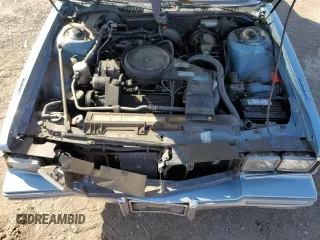 1986 Cadillac DeVille z VIN 1G6CD6982G4356663, wystawiony jako Copart lot #56716825 z przebiegiem 111 583 mil mil oraz Tytuł czysty. Historia ofert i sprzedaży dostępna na DreamBid. Obrazek 11.