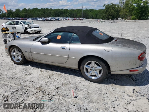 1999 Jaguar XK z VIN SAJGX2049XC034022, wystawiony jako Copart lot #55690025 z przebiegiem Nie podano mil oraz Tytuł czysty. Historia ofert i sprzedaży dostępna na DreamBid. Obrazek 2.