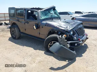 2016 Jeep Wrangler Unlimited Rubicon z VIN 1C4BJWFG7GL274673, wystawiony jako IAAI lot #42532134 z przebiegiem 166 661 mil mil oraz . Historia ofert i sprzedaży dostępna na DreamBid. Obrazek 1.