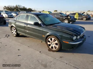 2004 Jaguar X-Type with VIN SAJEA51C24WE14915, listed as a Copart auction lot 77828734 with 0 mi miles and Salvage Title. Bid and sale history available at carsss.com. Image 4.