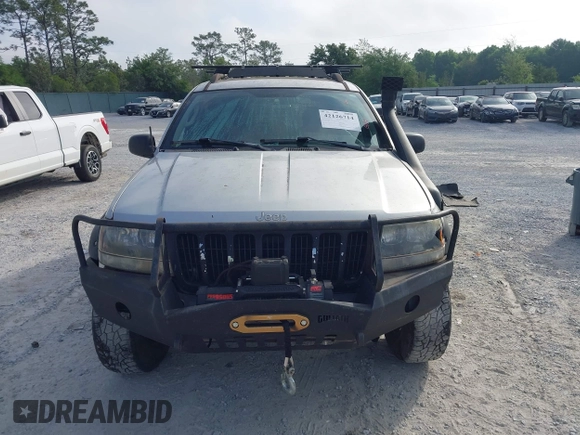 2003 Jeep Grand Cherokee Laredo z VIN 1J8GW48S33C519680, wystawiony jako IAAI lot #42126714 z przebiegiem 295 517 mil mil oraz . Historia ofert i sprzedaży dostępna na DreamBid. Obrazek 12.