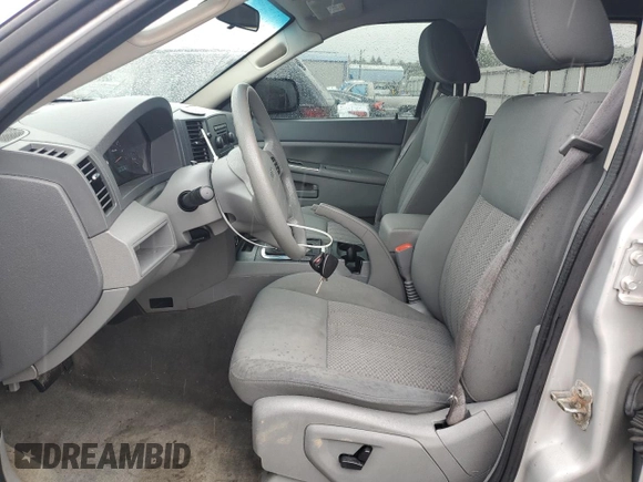 2005 Jeep Grand Cherokee Laredo with VIN 1J4GR48K55C719634, listed as a Copart auction lot 61809195 with 141,316 mi miles and Salvage title. Bid and sale history available at DreamBid. Image 7.