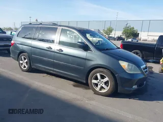 2006 Honda Odyssey Touring z VIN 5FNRL38826B027110, wystawiony jako IAAI lot #42096478 z przebiegiem 189 615 mil mil oraz . Historia ofert i sprzedaży dostępna na DreamBid. Obrazek 1.