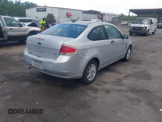 2008 Ford Focus SE with VIN 1FAHP33N58W121614, listed as a IAAI auction lot 42535574 with 156,624 mi miles and . Bid and sale history available at DreamBid. Image 4.