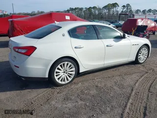 2015 Maserati Ghibli with VIN ZAM57XSA6F1156252, listed as a IAAI auction lot 41530186 with 84,417 mi miles. Bid and sale history available at carsss.com. Image 4.