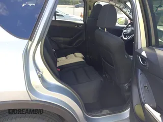 2016 Mazda CX-5 Touring z VIN JM3KE4CY4G0646114, wystawiony jako IAAI lot #42269181 z przebiegiem 58 252 mil mil oraz . Historia ofert i sprzedaży dostępna na DreamBid. Obrazek 8.