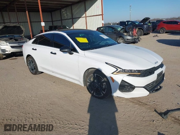 2022 Kia K5 GT-Line z VIN 5XXG64J23NG089623, wystawiony jako IAAI lot #42109751 z przebiegiem 128 273 mil mil oraz . Historia ofert i sprzedaży dostępna na DreamBid. Obrazek 1.