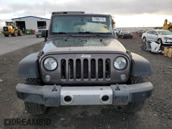 2018 Jeep Wrangler JK Unlimited Sport S with VIN 1C4BJWDG7JL814744, listed as a Copart auction lot 77830714 with 130,229 mi miles and Salvage Title. Bid and sale history available at carsss.com. Image 5.