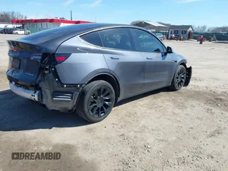 2023 Tesla Model Y Long Range with VIN 7SAYGDEE2PF883687, listed as a IAAI auction lot 41589837 with 36,890 mi miles. Bid and sale history available at carsss.com. Image 4.