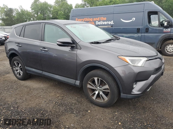 2018 Toyota RAV4 XLE with VIN 2T3WFREV0JW445322, listed as a Copart auction lot 55623845 with 116,700 mi miles and Salvage title. Bid and sale history available at DreamBid. Image 4.