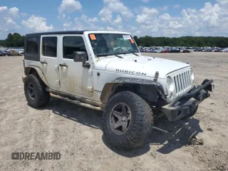 2015 Jeep Wrangler Unlimited Rubicon with VIN 1C4BJWFG6FL710993, listed as a Copart auction lot 62308195 with 103,938 mi miles and Salvage title. Bid and sale history available at DreamBid. Image 4.