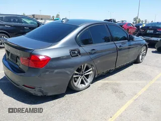 2014 BMW 3 Series 328d with VIN WBA3D3C51EK155031, listed as a IAAI auction lot 42149784 with 204,521 mi miles and . Bid and sale history available at carsss.com. Image 4.