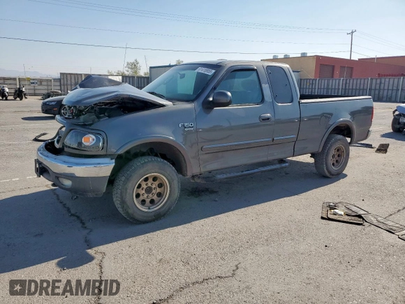 2002 Ford F-150 XL with VIN 1FTPX18L32NB65156, listed as a Copart auction lot 61418955 with 176,622 mi miles and Salvage title. Bid and sale history available at DreamBid. Image 1.