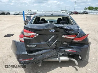 2020 Ford Fusion SE z VIN 3FA6P0LUXLR254247, wystawiony jako Copart lot #60658095 z przebiegiem 76 413 mil mil oraz Szkoda całkowita • Salvage title. Historia ofert i sprzedaży dostępna na DreamBid. Obrazek 6.