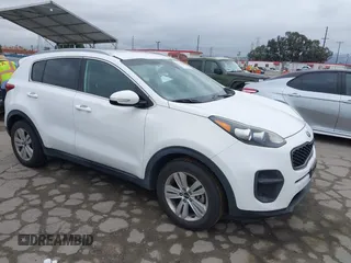 2018 Kia Sportage LX with VIN KNDPM3AC1J7413227, listed as a IAAI auction lot 42188566 with 77,897 mi miles and . Bid and sale history available at carsss.com. Image 1.