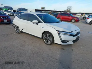 2018 Honda Clarity z VIN JHMZC5F14JC002263, wystawiony jako IAAI lot #41353651 z przebiegiem 153 401 mil mil oraz . Historia ofert i sprzedaży dostępna na DreamBid. Obrazek 1.