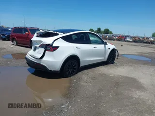 2023 Tesla Model Y Long Range z VIN 7SAYGDEE9PF753051, wystawiony jako IAAI lot #39615839 z przebiegiem Nie podano mil oraz . Historia ofert i sprzedaży dostępna na DreamBid. Obrazek 4.